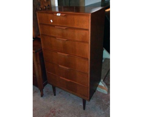 A 25 1/4" vintage teak effect and mixed wood chest with flight of six long graduated drawers, set on slender square tapered l
