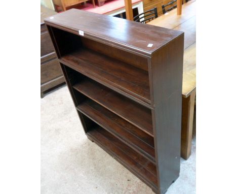 A 35" vintage stained wood sectional four shelf open bookcase