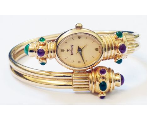 An Indian Titan marked 18k ornate lady's dress wristwatch, set with emerald and ruby cabochons, from the Tanishq range, with 