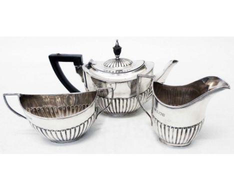 A three piece silver tea set of semi-reeded design with small teapot - William Hutton &amp; Sons Ltd., London 1897