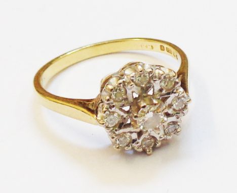 A hallmarked 750 gold diamond cluster ring 