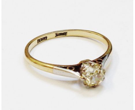 An 18ct. gold and platinum diamond solitaire ring