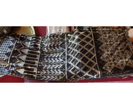 A length of Art Deco style net material with metal beaded embroidery