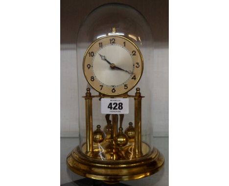 A vintage Koma anniversary clock under glass dome