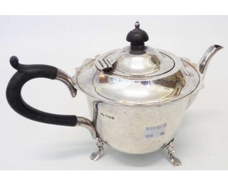 A Mappin &amp; Webb silver teapot with shaped rim, set on stylised paw pattern feet - Sheffield 1915