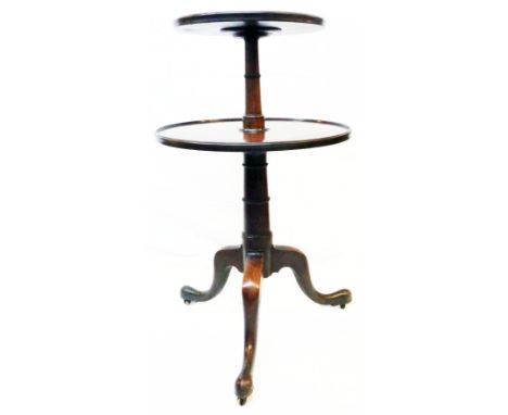 A 19th Century mahogany two tier dumb waiter, set on turned pillar and tripod base with brass roller casters