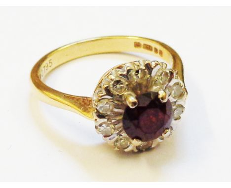 A marked 750 gold ring, set with ruby and diamond