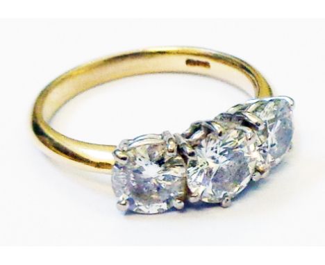 A marked 750 yellow metal three stone diamond ring - approx. 3.5 ct. TDW