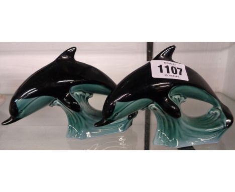 Two Poole pottery dolphins