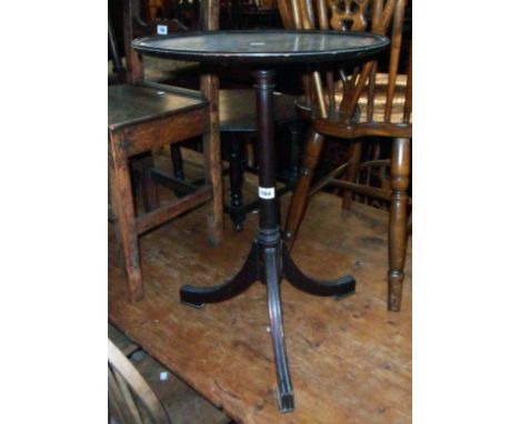 A 17" diameter mahogany pedestal wine table, set on turned pillar and moulded tripod base - repair