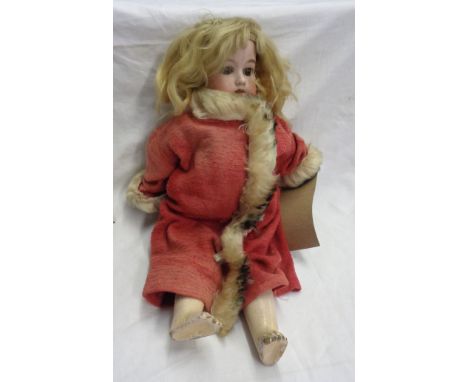 A late 19th Century Armand Marseille bisque headed doll marked 390 1M, with composition body and fur-trimmed coat