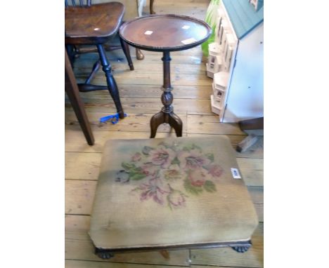 A Regency mahogany framed footstool with floral tapestry upholstery and reeded squat bun feet - sold with a mahogany pedestal