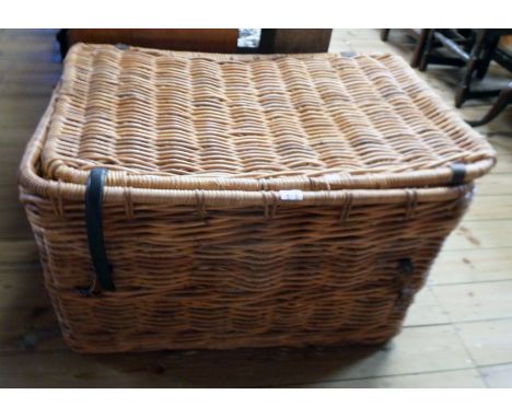 A 35" vintage wicker laundry basket with flanking loop handles
