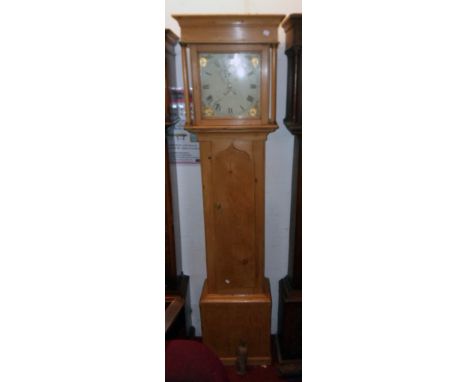 A 19th Century waxed pine longcase clock, the 11" painted square dial with date aperture and seconds dial, with thirty hour b