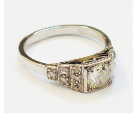 A 1930`s Art Deco marked "PLAT" ring, set with central 0.5ct. diamond and further diamonds to stepped shoulders