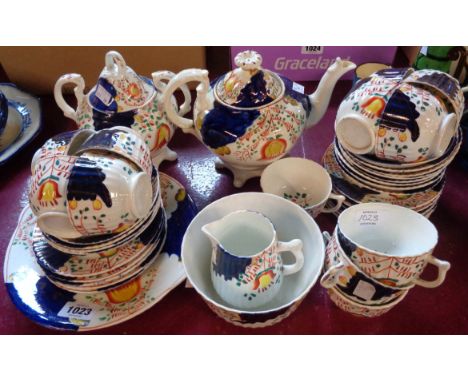 A Gaudy Welsh twelve place tea set including teapot, jug and sucrier