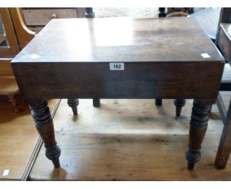 A 19th Century mahogany bidet with lid and china liner, set on ring turned legs