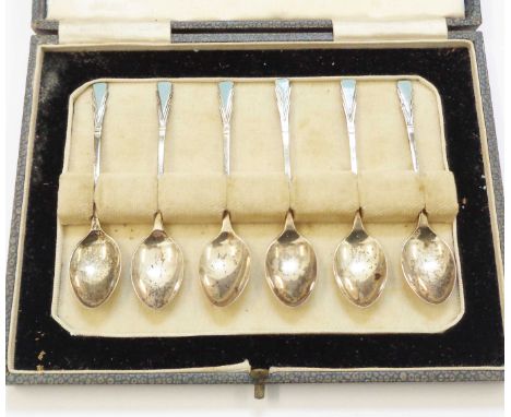 A cased set of six Art Deco part enamelled silver coffee spoons - Birmingham 1933 - various condition