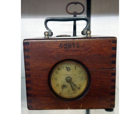 An early 20th Century polished oak cased Plasschaert pigeon racing clock bearing number 42915 and named for F. Yardley