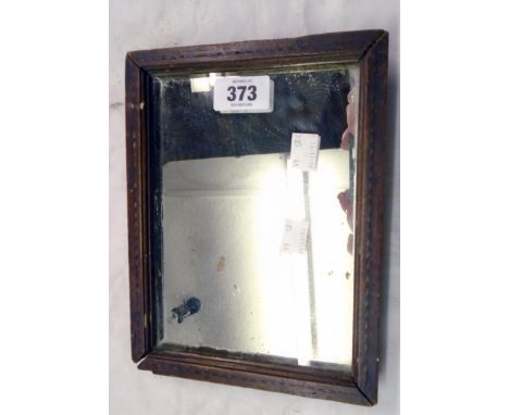 A late Georgian stained wood and strung framed small mirror with old plate