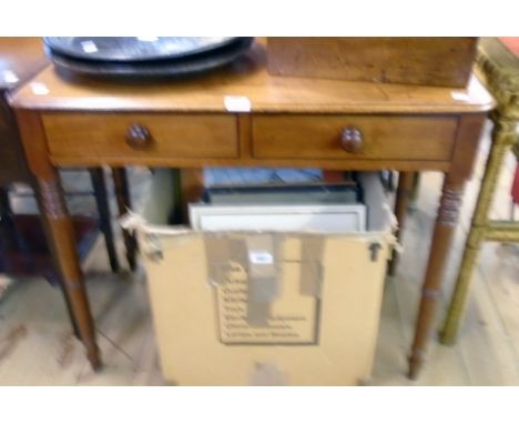 A 34 1/2" 19th Century mahogany and ebony strung side table with two frieze drawers, set on ring turned legs