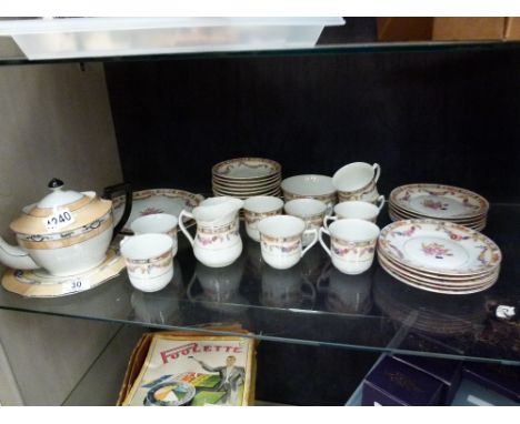 Shelf of china tea ware