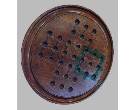 A Vintage Solitaire board with a complete set odd sized marbles. 