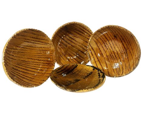 Dr Allan Peacey Studio Pottery - Four slipware dishes with crinkle borders and combed finish, average diameter 28 cm, the maj