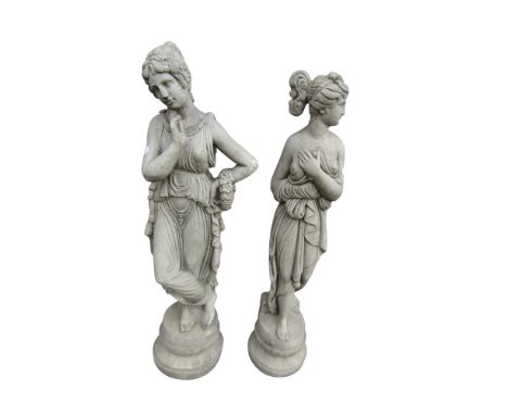 Two small cast composition stone garden ornaments in the form of scantily clad classical maidens 64 cm high 