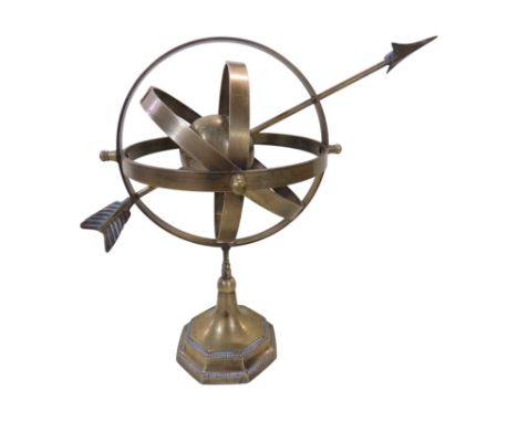 An vintage brass armillary globe sundial, with four radials around a central globe pierced by an arrow, 34cm high.