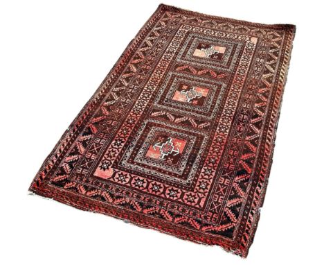 An Afghan brown toned rug with three square central panels 180cm x 110cm 