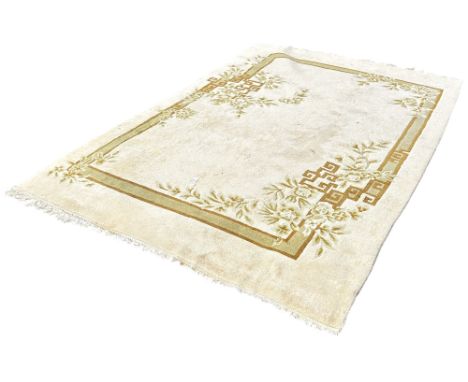 A Chinese style cream wool rug boarders with flowers and Greek key patterns 