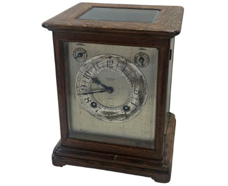 A small oak cased bracket clock, silvered dial with chapter ring, alarm and speed dials, ‘Wray Son &amp; Perry’, Birmingham, 