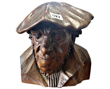 A carved wooden life size study of a man’s head wearing a beret, bearing a lower case “e” dated 1938 to left shoulder togethe