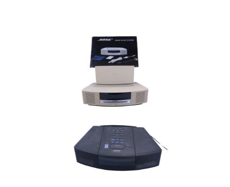 A Bose Wave Music System, model AWRC-2G, with an extension speaker, remote control, cables, and instruction manual, together 