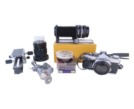 Photographic equipment including an Olympus OM-2 camera, a Tamron 28-70mm zoom lens, a Sunagor Quick Extension Bellow 7 inch 
