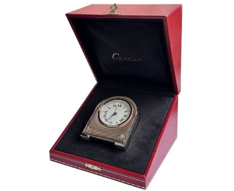 Cartier. A stainless steel and enamel quartz desk clock with alarm, Ref 2746, quartz movement, polished arched case, 8cm high