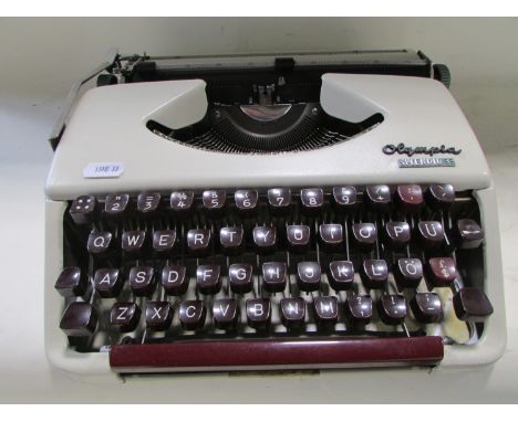 A vintage manual typewriter the Olympia Splendid 33 in travel case 