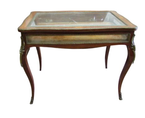 A 19th century French table vitrine in walnut with floral marquetry detail on cabriole supports with applied gilt mounts, 74c