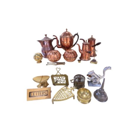 A mixed selection of brass and copper ware including coffee pots, a brass urn shaped sugar bowl, letter box, a pewter funnel,
