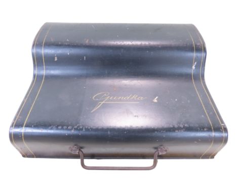 A Gundka miniature typewriter with a black meta removable lid, circa 1920’s.