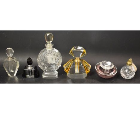 A Guerlain insolence sent bottle; an Art Deco amber and clear glass scent bottle; others (6)
