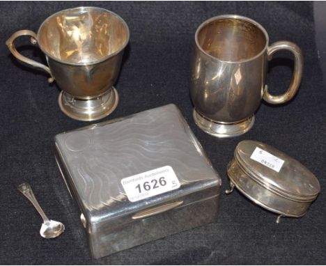 A silver rounded rectangular cigarette box and cover, engine turned, London 1913; a silver christening cup, Birmingham 1922, 