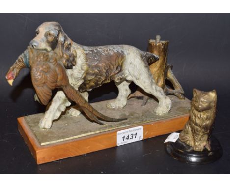 A painted spelter match striker, as a standing setter with phesant, tree trunk striker, wooden plinth;  a seated cat (2)