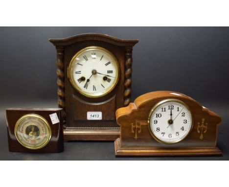 An oak cased mantle clock, white enamel dial, Roman numerals, twin winding holes; another; a small wall barometer
