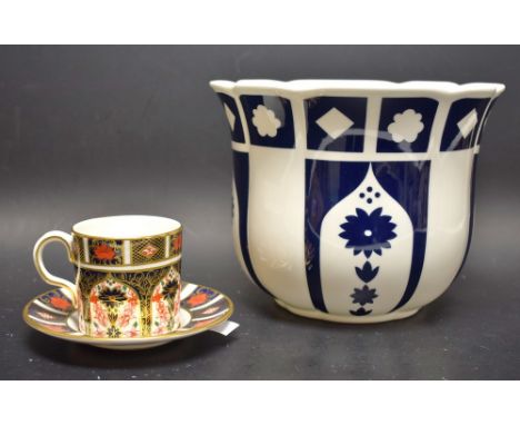 A Royal Crown Derby 1128 coffee can and saucer; a blue and white unfinished planter