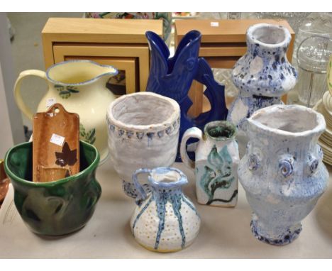 Studio Pottery - a triple-gourd vase, glazed in tones of blue; a similar vase; a Poole jug, decorated with citrus fruit; vase