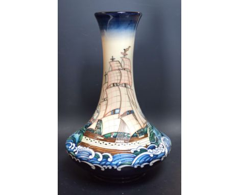 A large Moorcroft bottle vase, by Paul Hilditch, signed, decorated with ships on choppy seas, numbered 69, impressed and prin