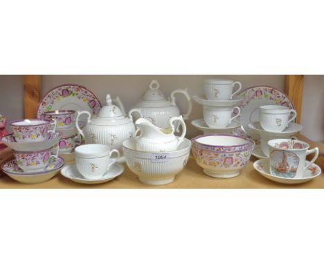 A Victorian lustre part tea service; a Victorian fluted tea service; moustache cup