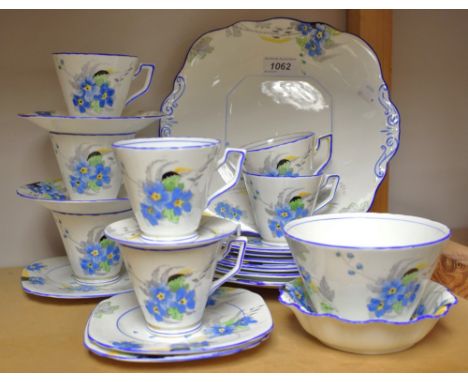 A Sutherland China Art Deco part tea service, decorated wioth blue floral sprays
